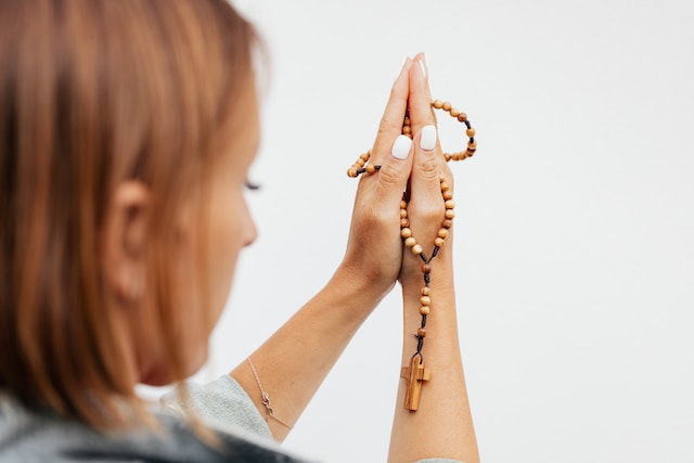 Photo by Karolina Grabowska: https://www.pexels.com/photo/woman-praying-holding-a-rosary-5206870/