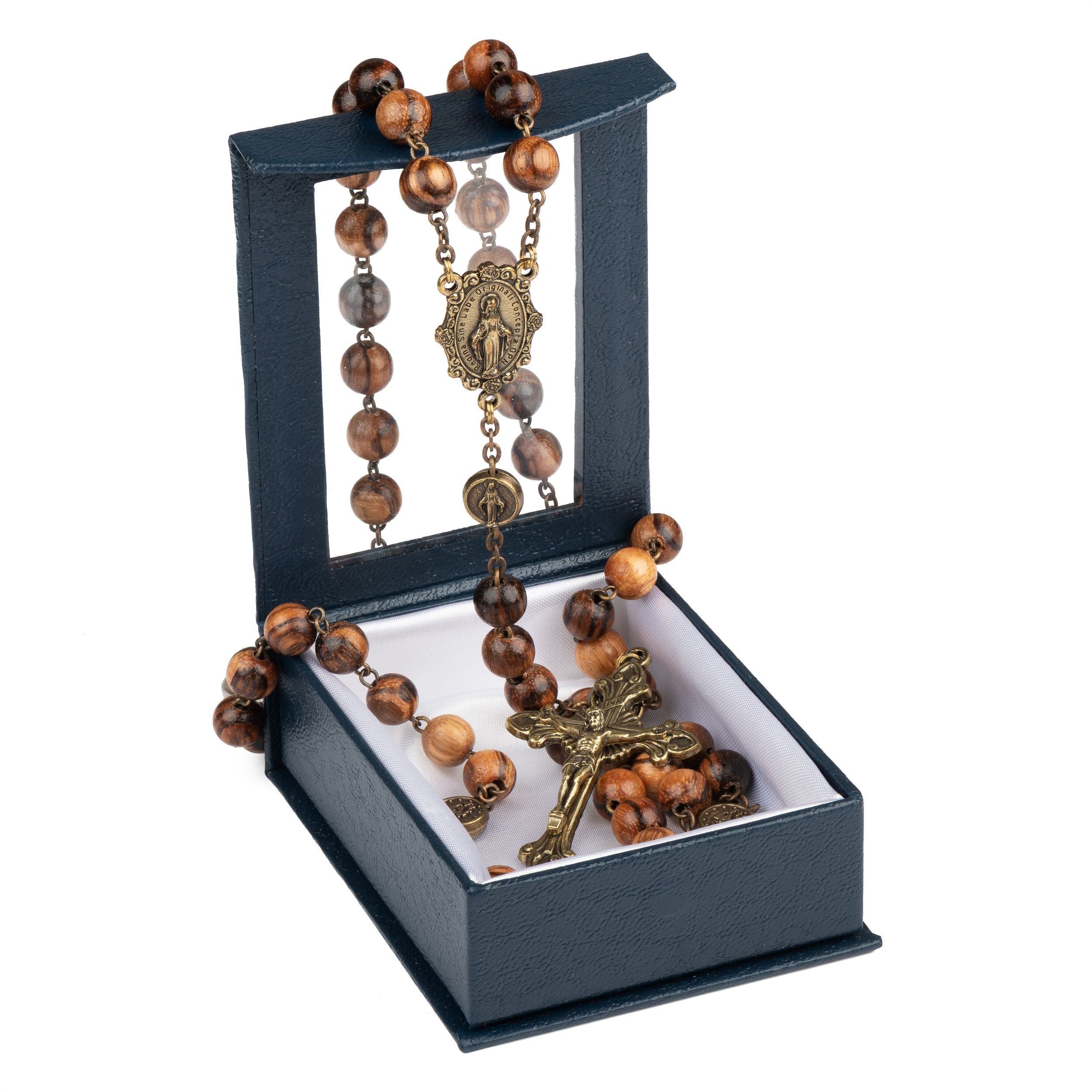 A religious rosary with brown wooden beads, a bronze-toned Our Lady of Fatima medal, and a matching crucifix, displayed inside an open dark blue presentation box on a white background.