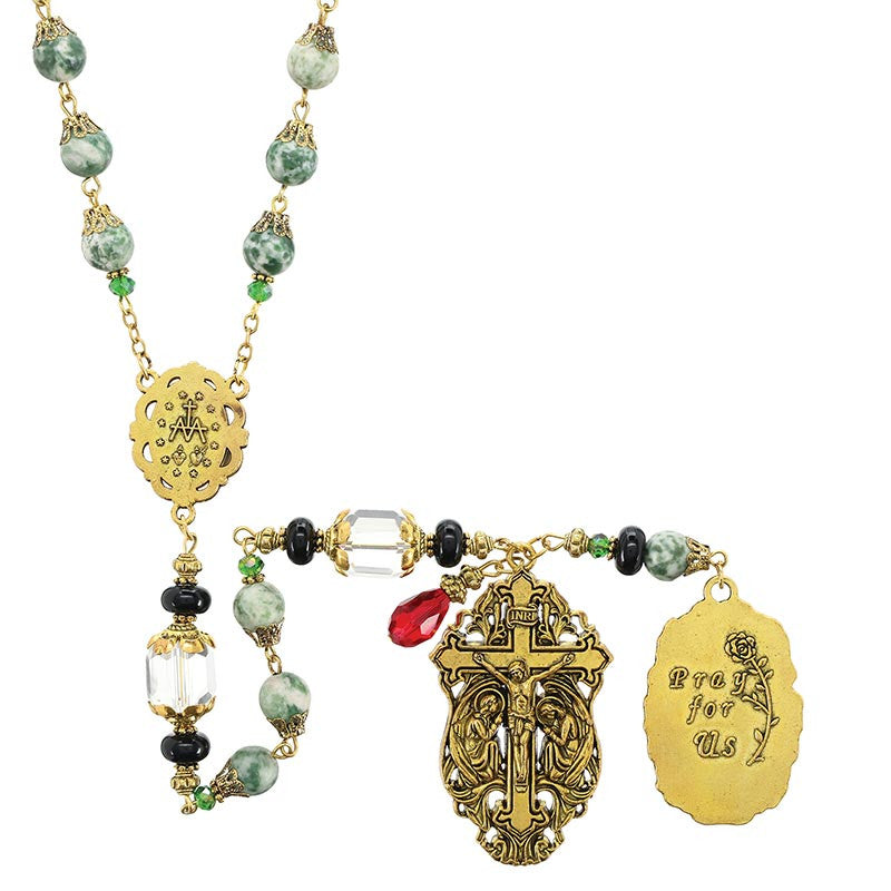 Gold-tone rosary necklace with green beads, crystal accents, and engraved 'Pray for Us' pendant.