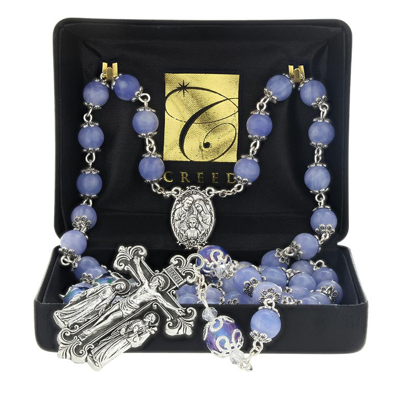 Holy Family Giulia Signorelli Rosary displayed in Creed gift box