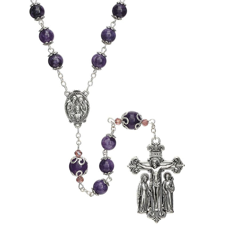 Holy Family Amethyst Rosary displayed on stone surface showing full rosary layout