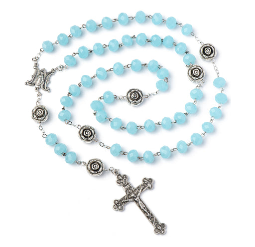 Blue rosary with silver cross and roses on a white background