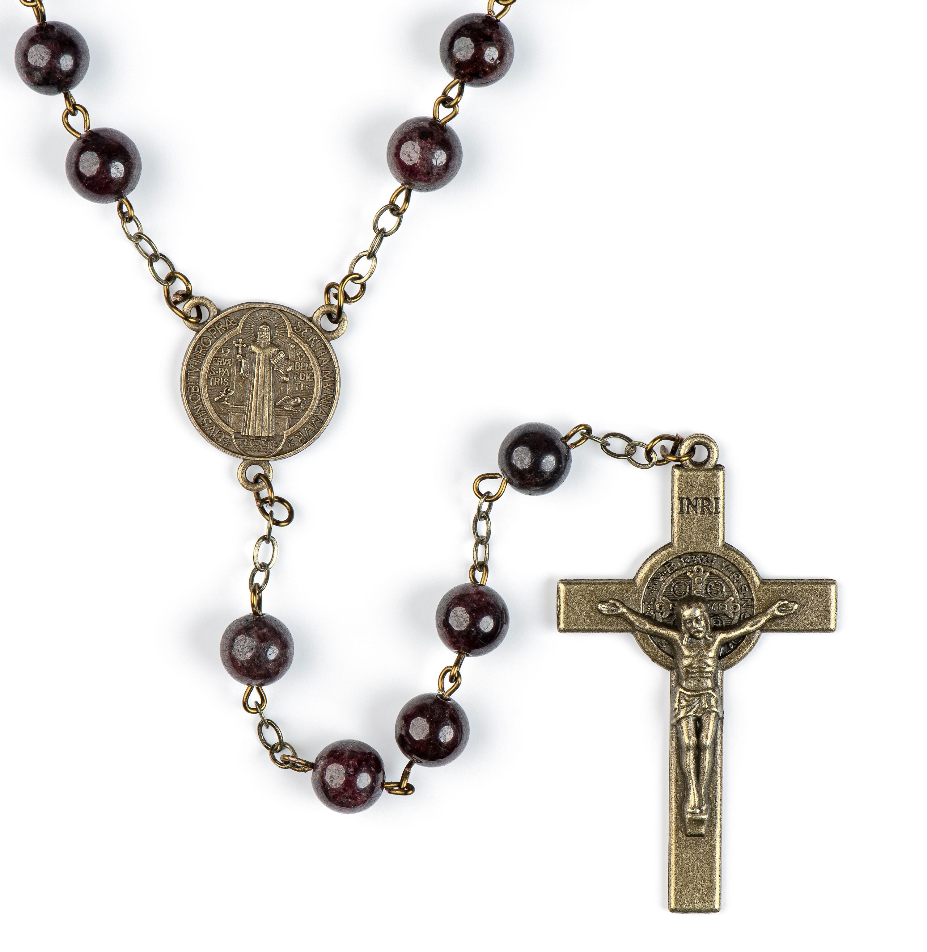 Rosary with brown beads and bronze metal components on a white background